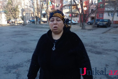 Əri yıxılaraq ölən qadın onu maşın vurduğunu iddia edir