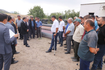 Doludan zərərçəkən sakinlərə dam örtüyü materialları verilir